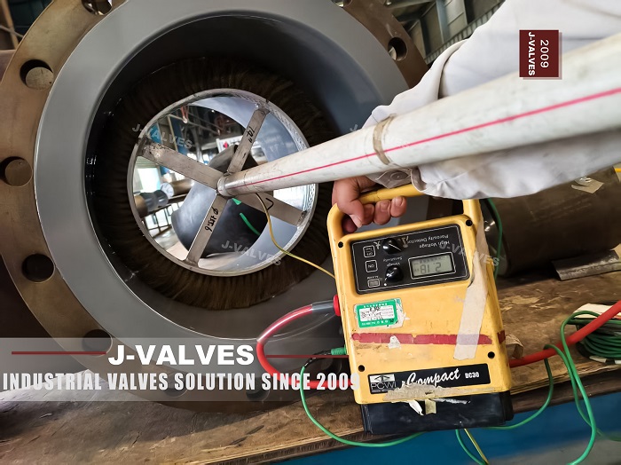 FBE coated ball valve with coating thickness gauge reading during J-VALVES quality inspection
