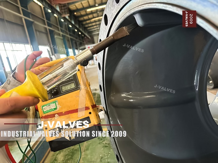 FBE coated ball valve with coating thickness gauge reading during J-VALVES quality inspection